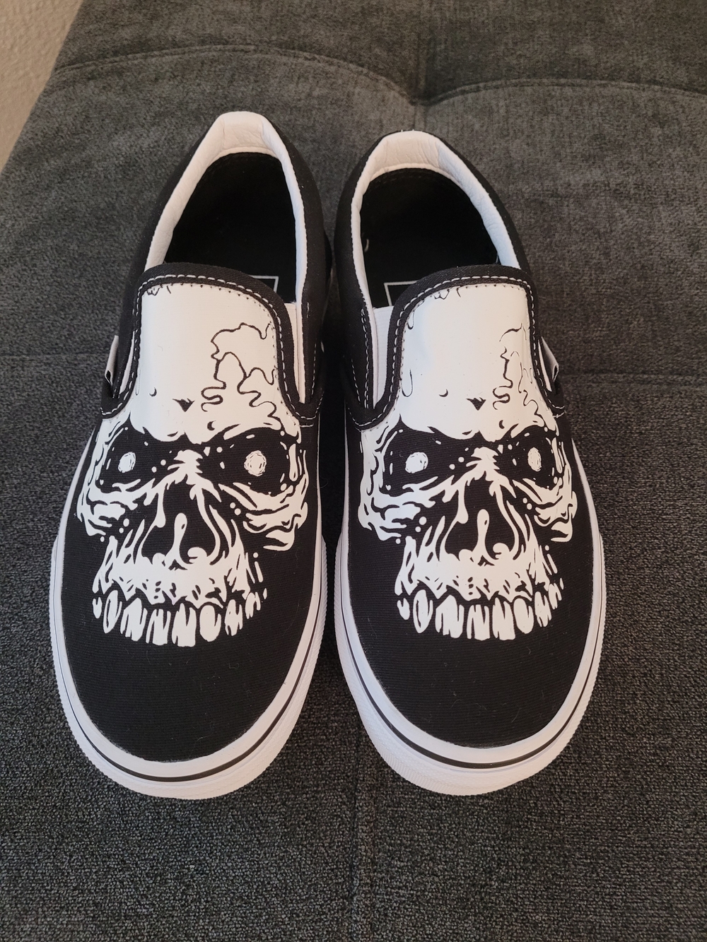 Vans Classic Kids Black & White Slip-On Sneakers with Skull Graphic